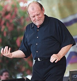 Cocker playing air guitar in Hallandale Beach, Florida, in 2003