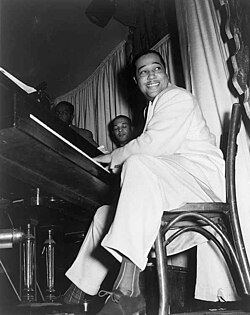 Duke Ellington straddled the big band and bebop genres. Ellington extensively used the blues form.[159]
