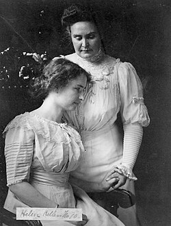Anne Sullivan (standing) with Helen Keller, c. 1909