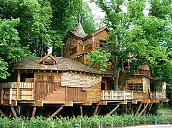Treehouse at Alnwick Gardens in the United Kingdom, with walkways through the tree canopy