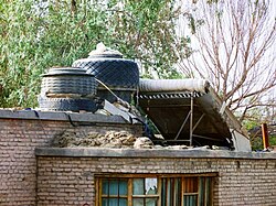 Tires recycled into water tanks on the roof in Cherchen, Xinjiang