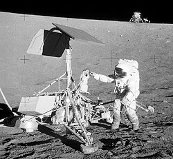 Astronaut Pete Conrad near Surveyor 3 during Apollo 12, 1969. Lunar Module in the background.