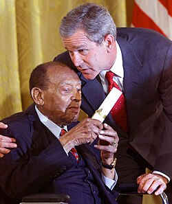 President George W. Bush honors Lionel Hampton during a ceremony recognizing Black Music Month in the White House in 2001.