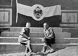 South African National Defence Force soldiers pose with a captured flag of Germany after their successful invasion of South West Africa in 1915.